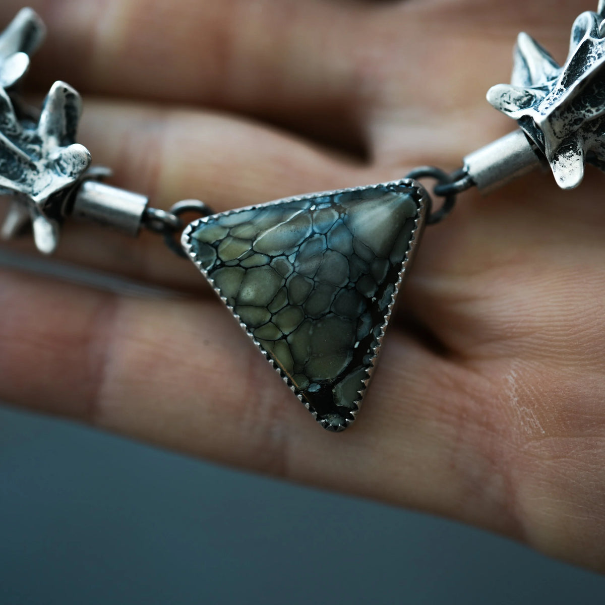 Ouroboros - Fossilized Snake Vertebrae Necklace, side view