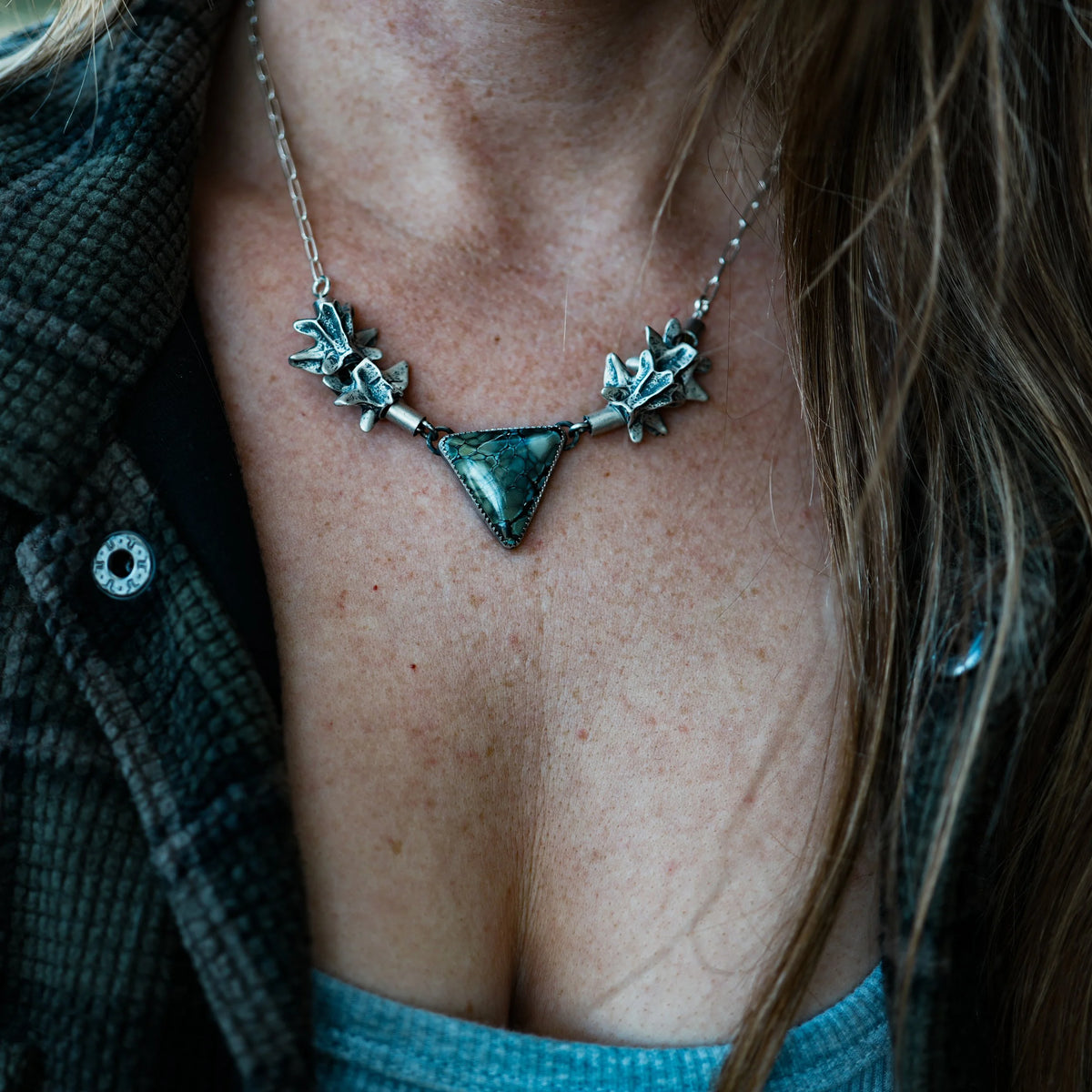 Ouroboros - Fossilized Snake Vertebrae Necklace, close-up detail