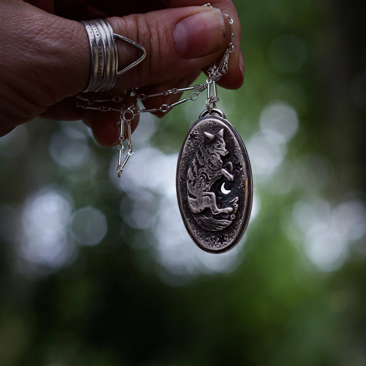 Celestial Canines - Silver Amulet, detail view