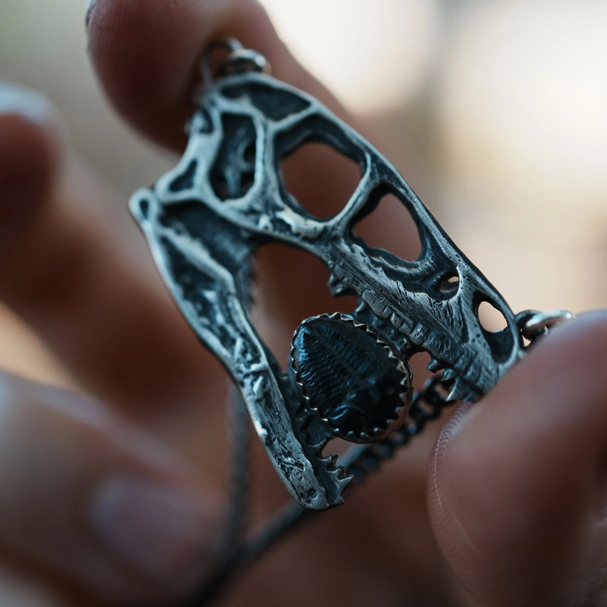 Velociraptor - Trilobite Necklace, close-up detail