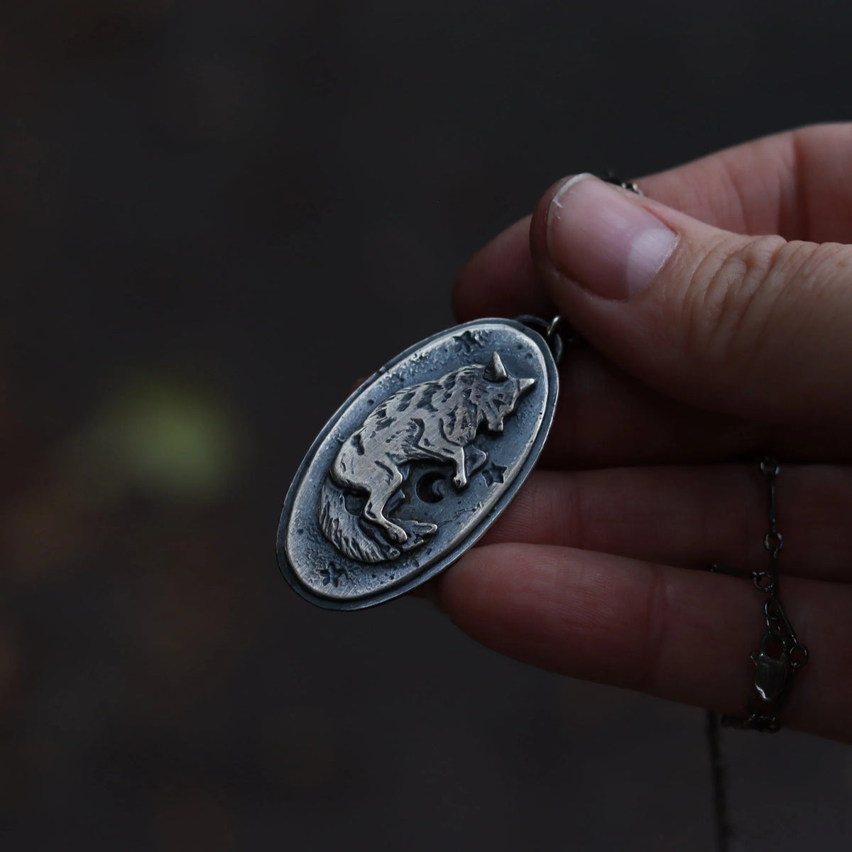 Celestial Canines - Silver Amulet, close-up detail